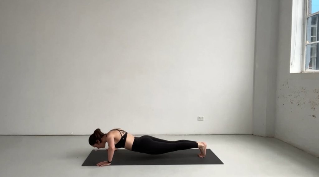 woman doing pilates arm burn exercise